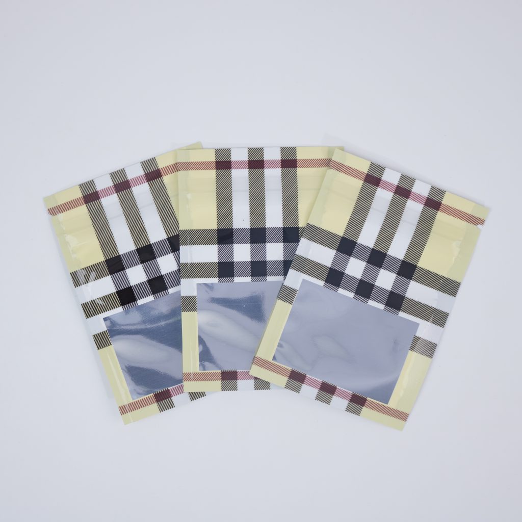 Custom Printed Plaid Mylar Zipper Bags with Clear Window and Heat-Sealable Top for Candy, Snacks and Dry Food Packaging